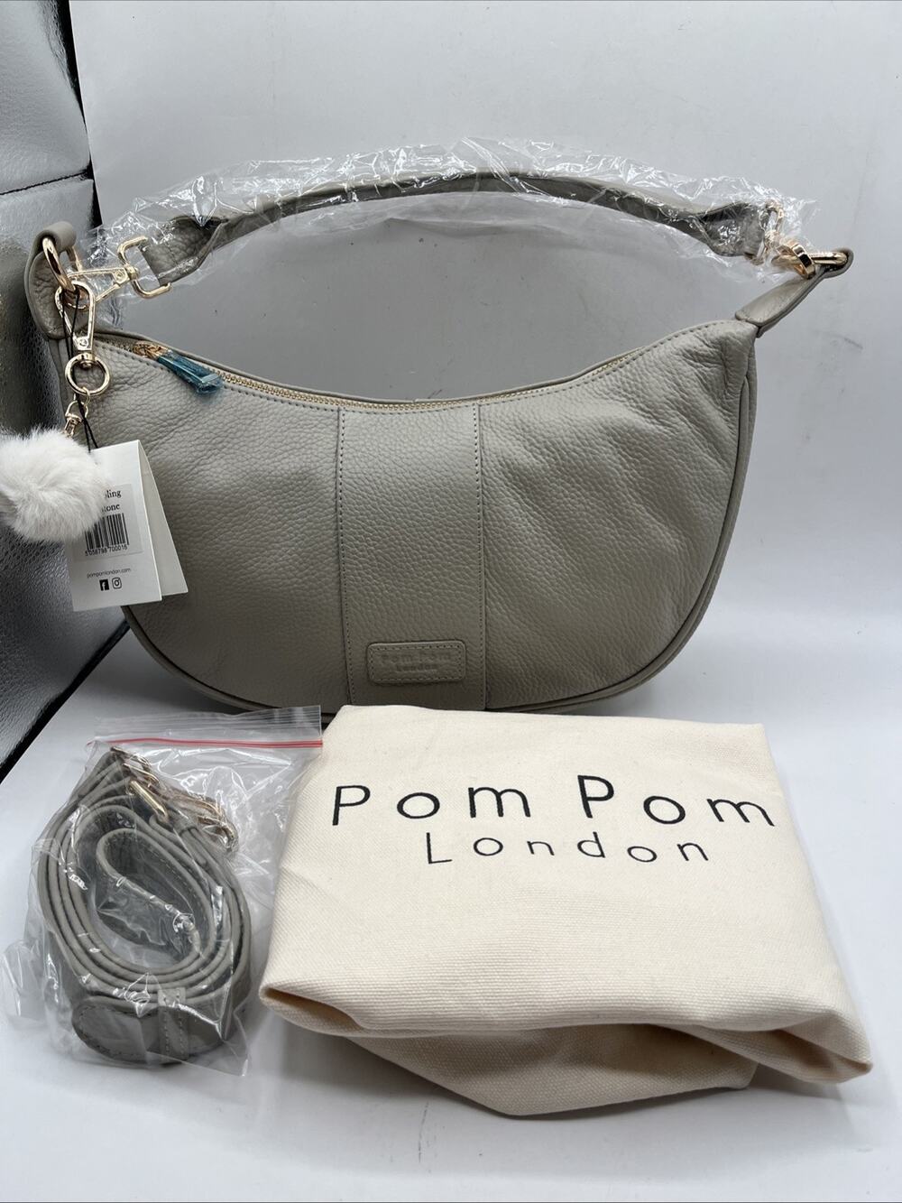 Pom Pom London Sutton Sling Bag Pebbled Leather Crescent Shape Stone Gray NWT